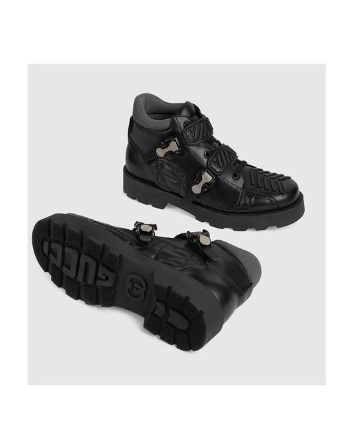 Gucci Black Buckled Leather Ankle Boots for men