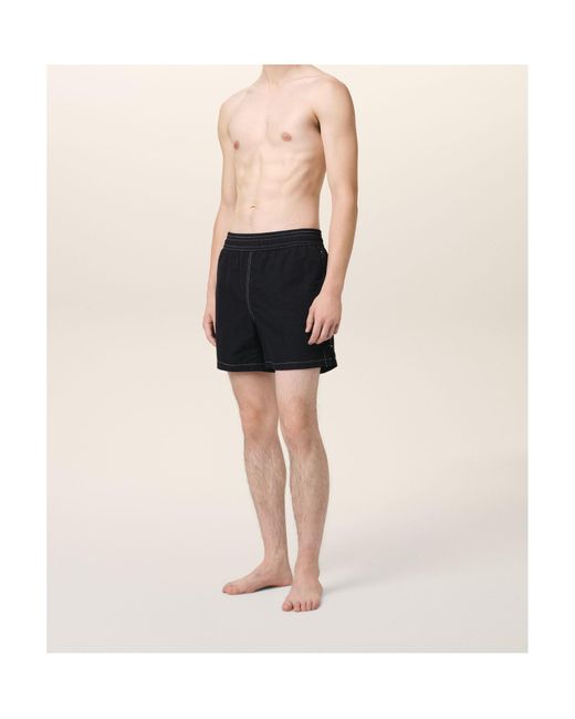 AMI Black Logo Embroidered Swim Shorts for men