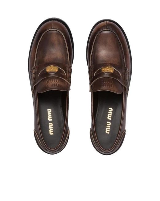 Miu Miu Brown Logo Embossed Slip-On Penny Loafers