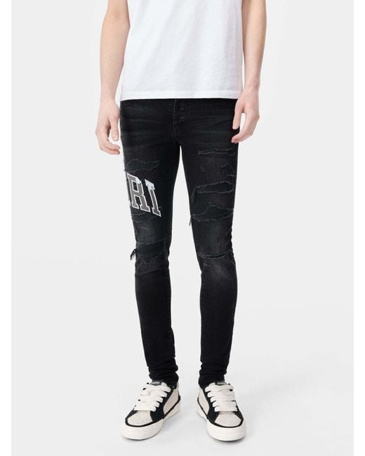 Amiri Black Varsity Logo Repair Jeans for men