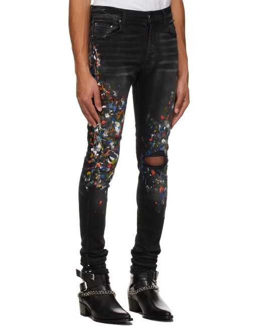 Amiri Black Paint Print Distressed Skinny Jeans for men
