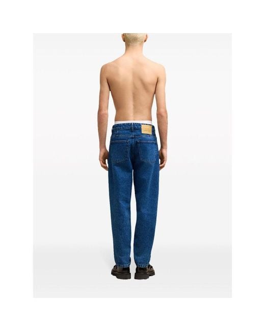 AMI Blue Logo Patch Tapered-Fit Jeans for men