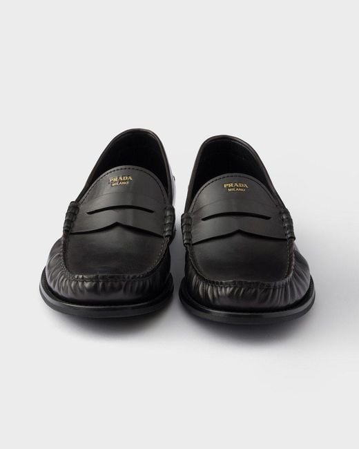 Prada Black Distressed Penny Loafers for men