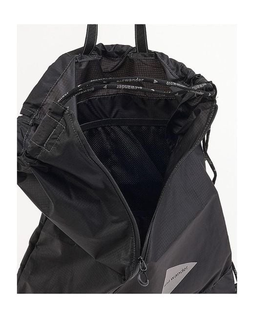 And Wander Black Drawstring Tote Bag for men