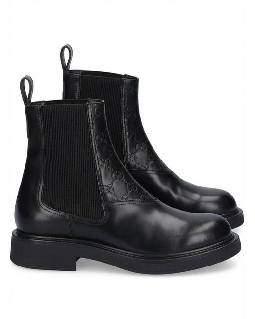 Gucci Black Gg Embossed Ankle Boots for men