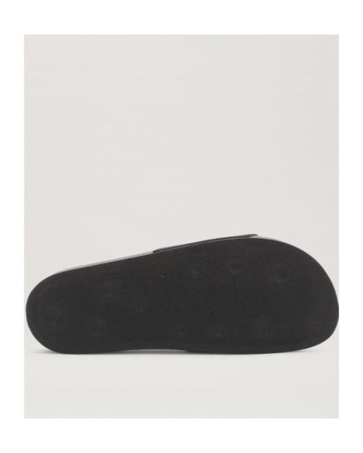 Palm Angels Black Logo Embossed Slippers for men