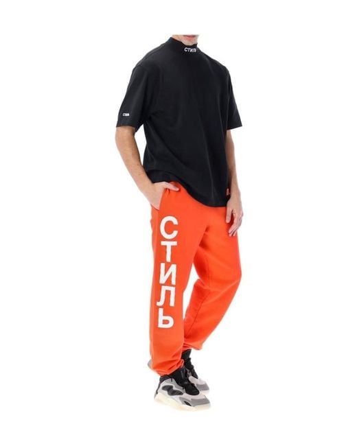 Heron Preston Orange Logo Print Elasticated-Waist Track Pants for men