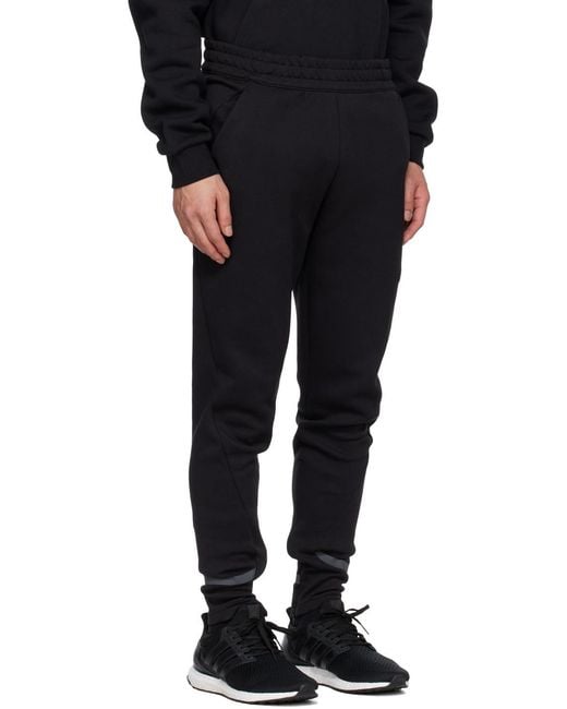 Adidas Originals Black Adidas Gameday Logo Patch Track Pants for men