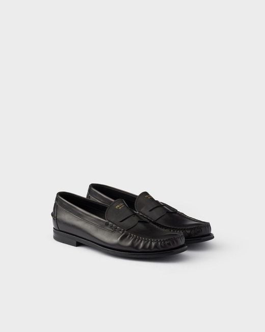 Prada Black Distressed Penny Loafers for men