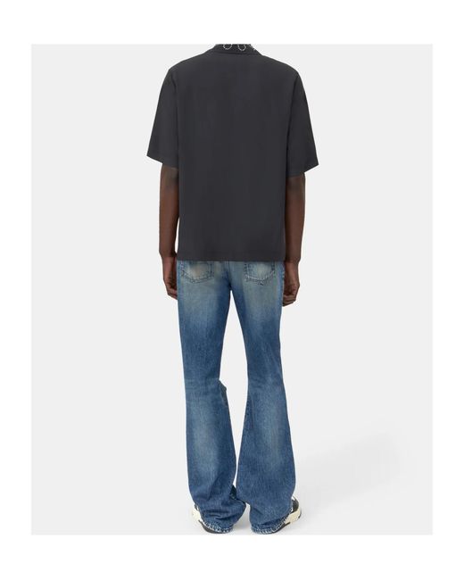 Amiri Blue Ripped-Knees Bootcut Denim Jeans for men