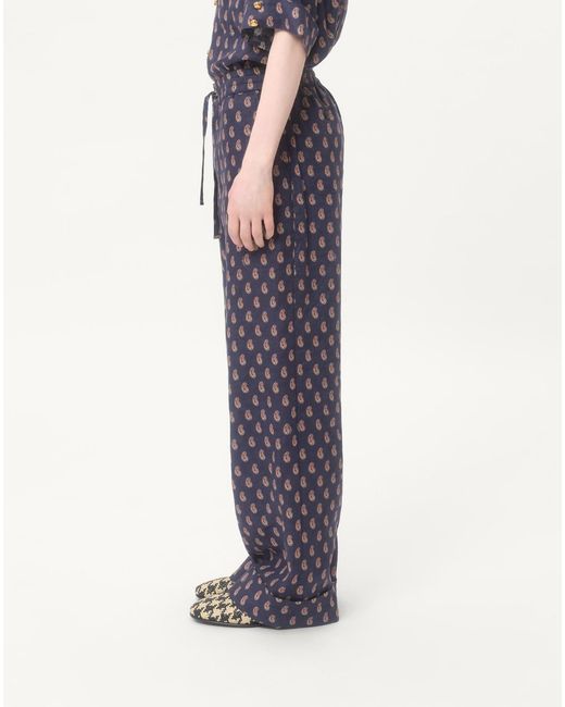 Valentino Blue Lightweight Cuffed Linen Trousers With Voyage Imaginaire Print for men