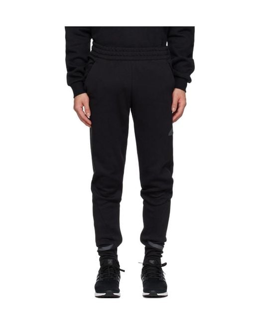 Adidas Originals Black Adidas Gameday Logo Patch Track Pants for men
