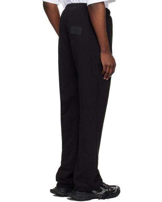 we11done Black Logo-Print Track Pants for men