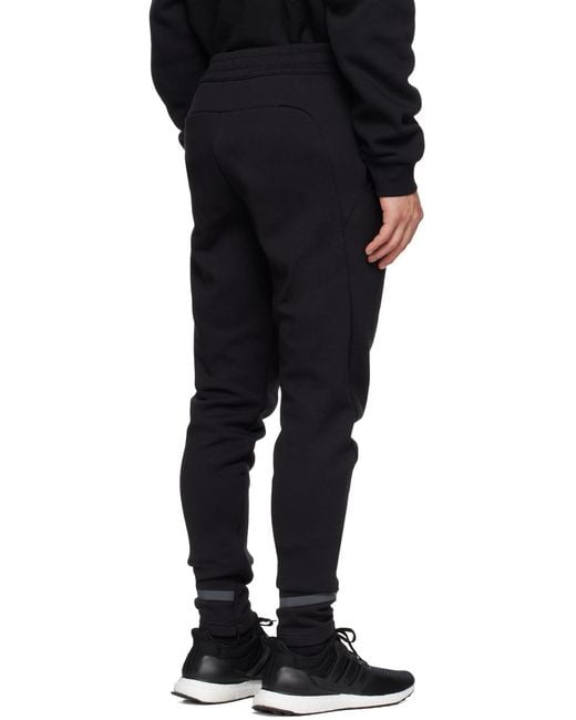 Adidas Originals Black Adidas Gameday Logo Patch Track Pants for men