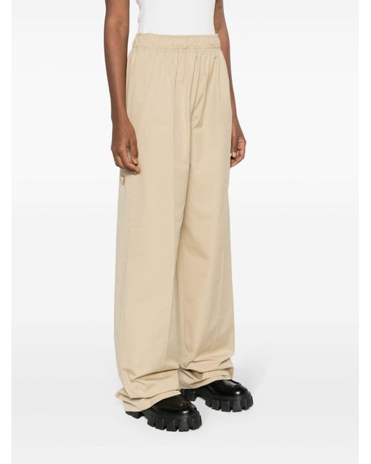Prada Natural Triangle-Logo Plaque Wide-Leg Pants