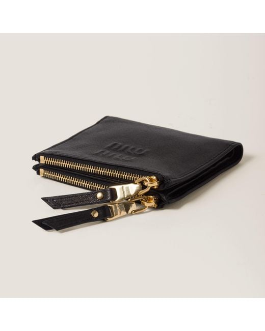 Miu Miu Black Logo Embossed Zipped Wallet