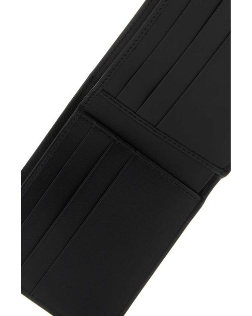 Dolce & Gabbana Black Logo Embossed Bifold Wallet for men