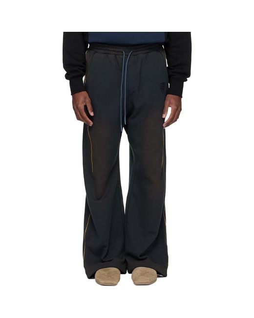 ANDERSSON BELL Blue Piping Dyed Sweatpants for men