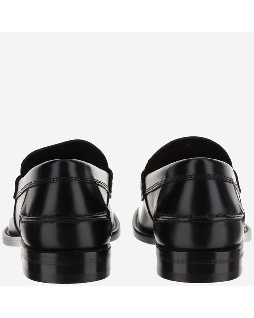 Tod's Black Round Toe Slip-On Loafers for men