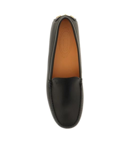 Tod's Black Round-Toed Flat Shoes