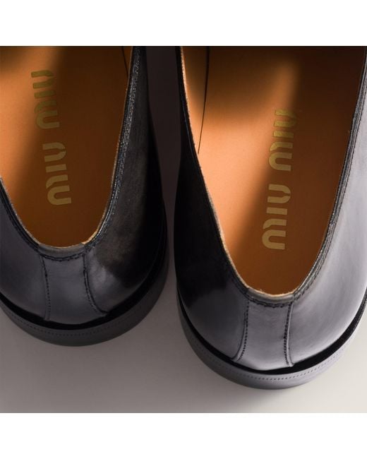 Miu Miu Black Logo-Embossed Mocassinis
