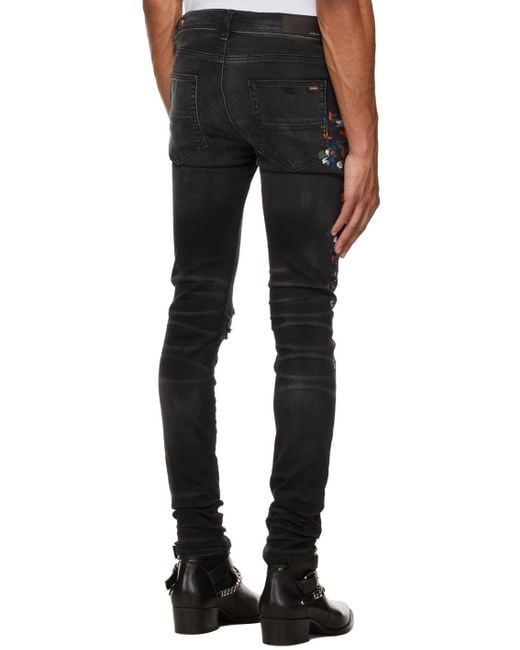 Amiri Black Paint Print Distressed Skinny Jeans for men