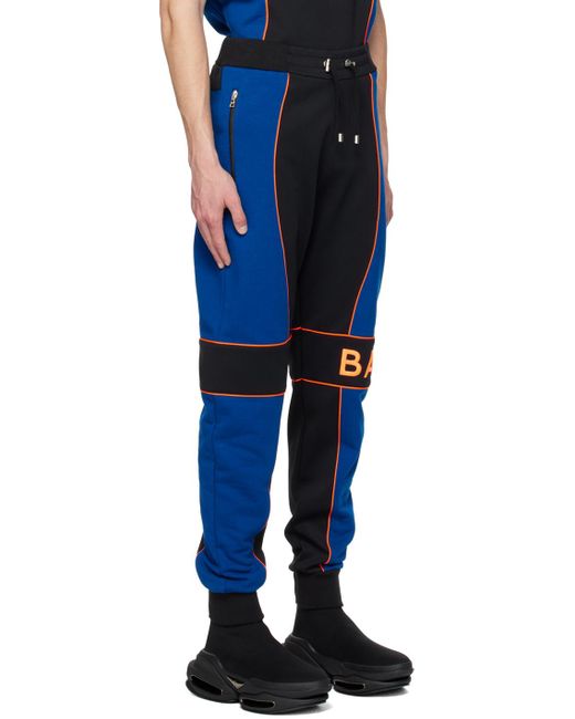 Balmain Blue Jogging Bottoms With Logo Inserts for men