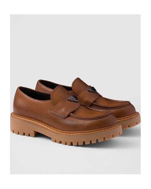 Prada Brown Logo Plaque Round Toe Loafers for men