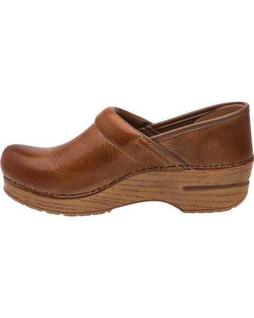 dansko distressed leather clogs