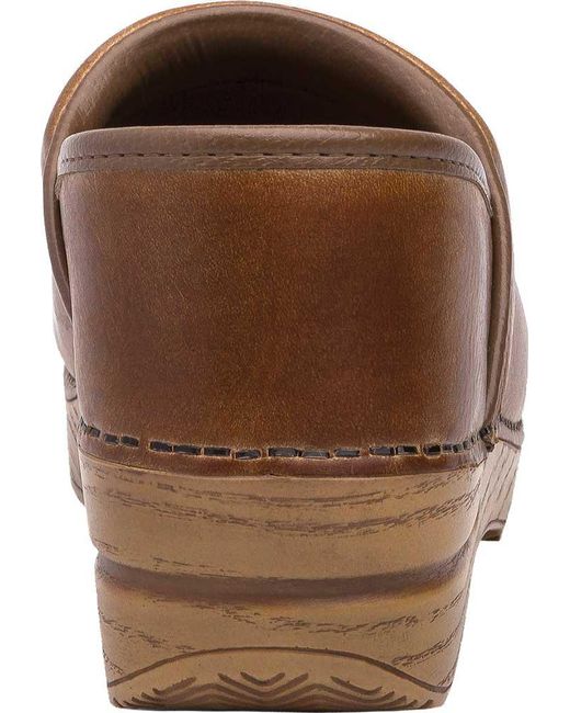 dansko distressed leather clogs