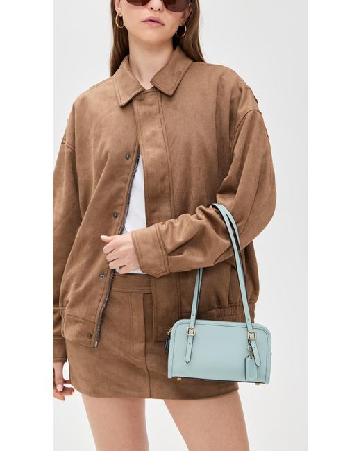 【Coach】Glovetanned Leather Swing Zip Bag 20 COACH Swing Zip Bag 20 | Zappos.com
