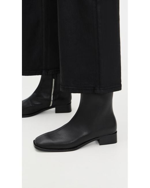 INTENTIONALLY ______ Black Tour Boots