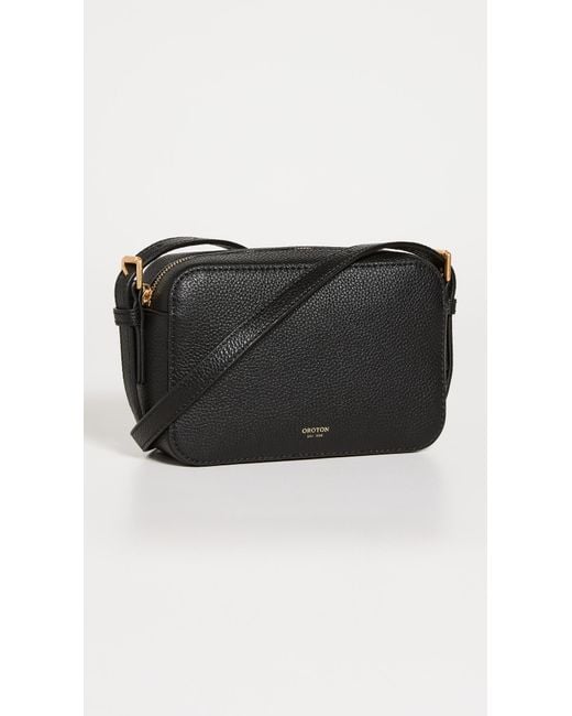 Oroton Leather Margot Zip Around Crossbody Bag in Black | Lyst