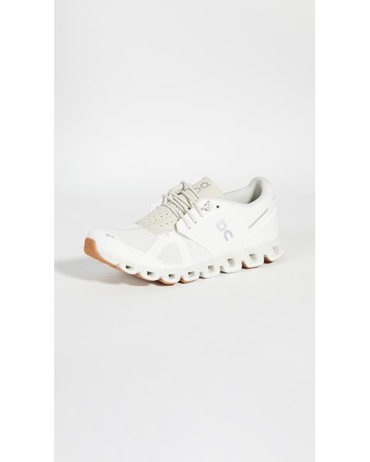 on cloud shoes white sand