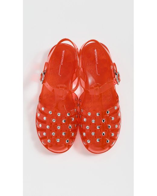 INTENTIONALLY ______ Red Ellery Studded Jelly Sandals