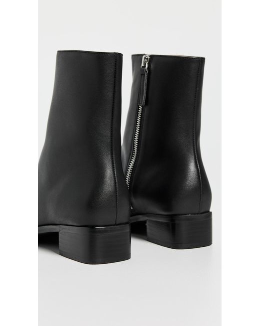 INTENTIONALLY ______ Black Tour Boots