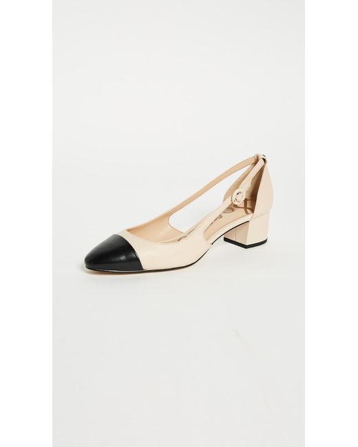 black pumps with white cap toe