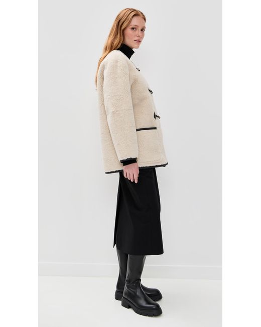 DUNST Natural Collarless Buckled Shearling Jacket
