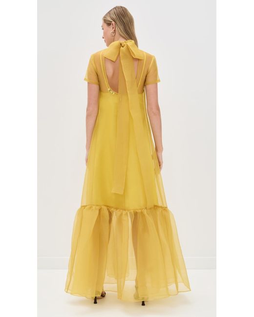staud yellow dress Valencia Linen The Mini Wells Dress has a square neckline and features a corset STAUD Calluna Dress in Yellow