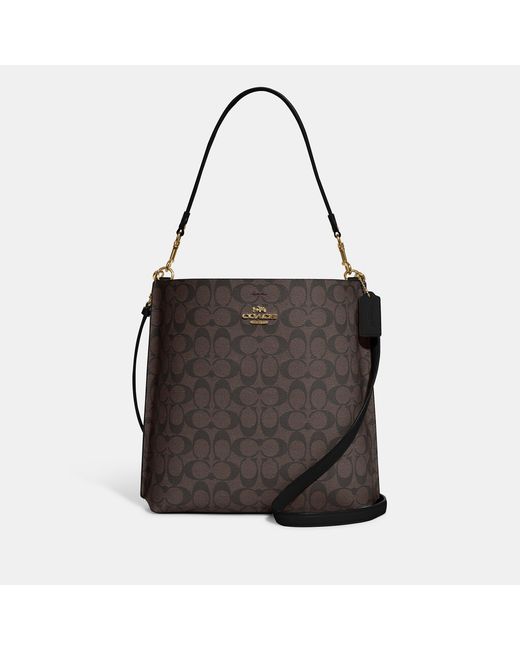 Coach Outlet Mollie Bucket Bag In Signature Canvas in Gold/Brown Black