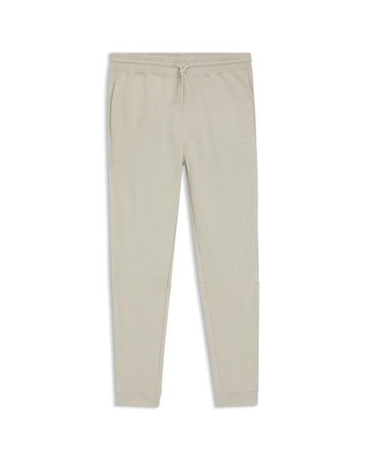 Boss Natural Cotton-Terry Tracksuit Bottoms With Logo Patch for men