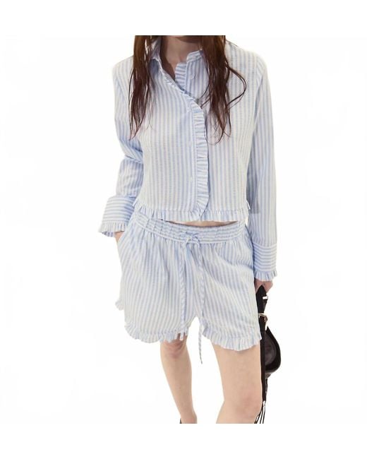 DELUC White Split Ruffled Hem Shorts