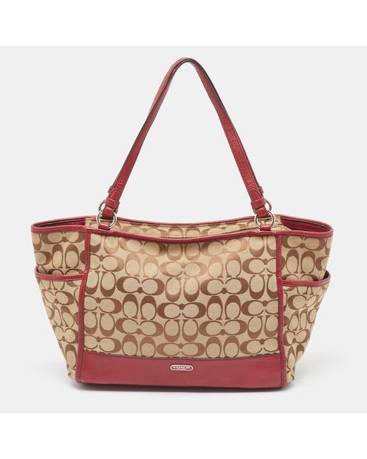 COACH Brown /burgundy Signature Canvas And Leather Carrie Tote