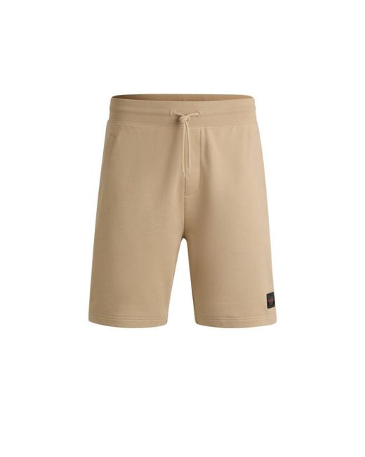 HUGO Natural Cotton-Terry Relaxed-Fit Shorts With Logo Trim for men
