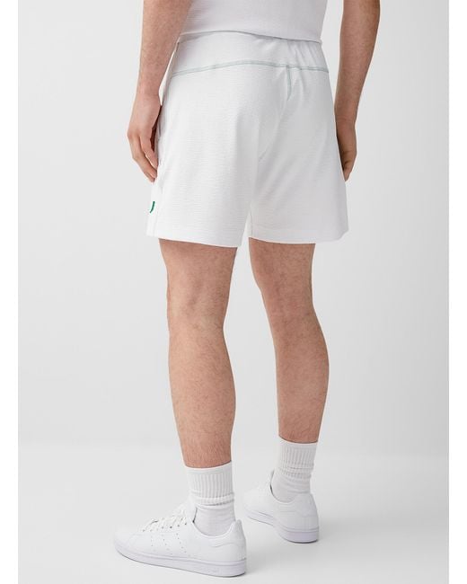 Reigning champ deals swim short