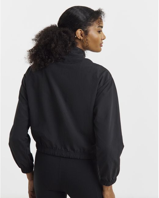 PUMA Black Her Relaxed Woven 1/2 Zip Crew