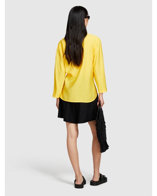Camicia Asimmetrica Con Fiocco di Sisley in Yellow