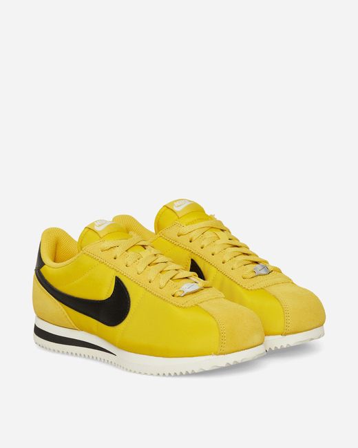 nike cortez black yellow