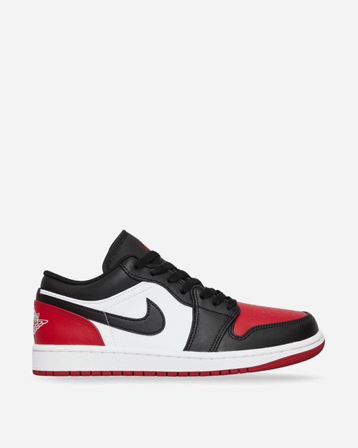 Red low top nikes best sale