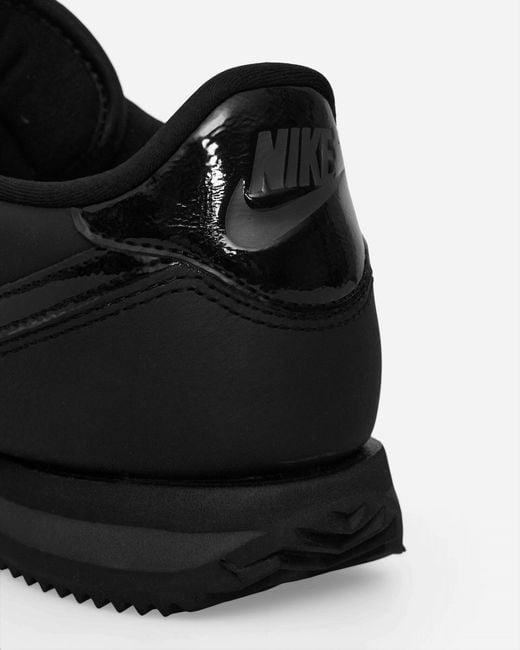 Nike women's black leather sneakers hot sale